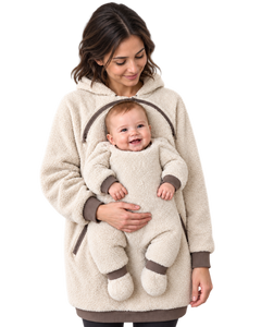 Cream REVINZA hoodie with a digitally created adult model and the original baby likeness; AI-enhanced product imagery